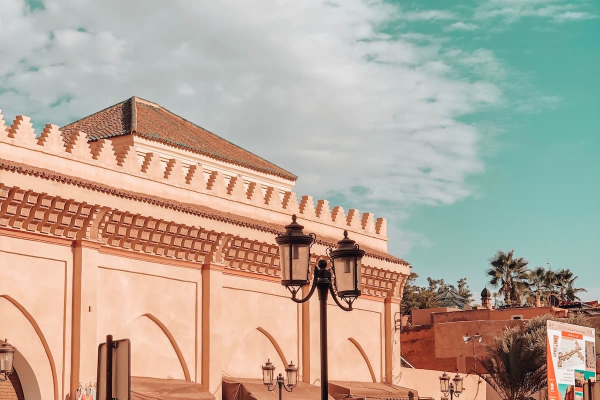 A reddish orange building with intricate architecture